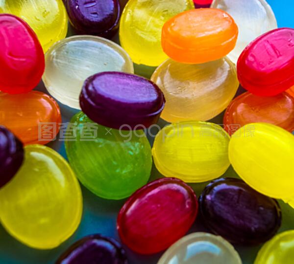 甜蜜的旋涡 圆形彩色棒棒糖的奇幻背景